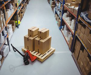 Warehouse shelves with inventory on forklift